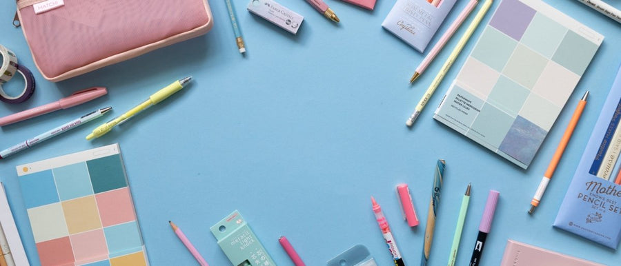 Under the Rowan Trees - Stationery flat lay on a light blue background.