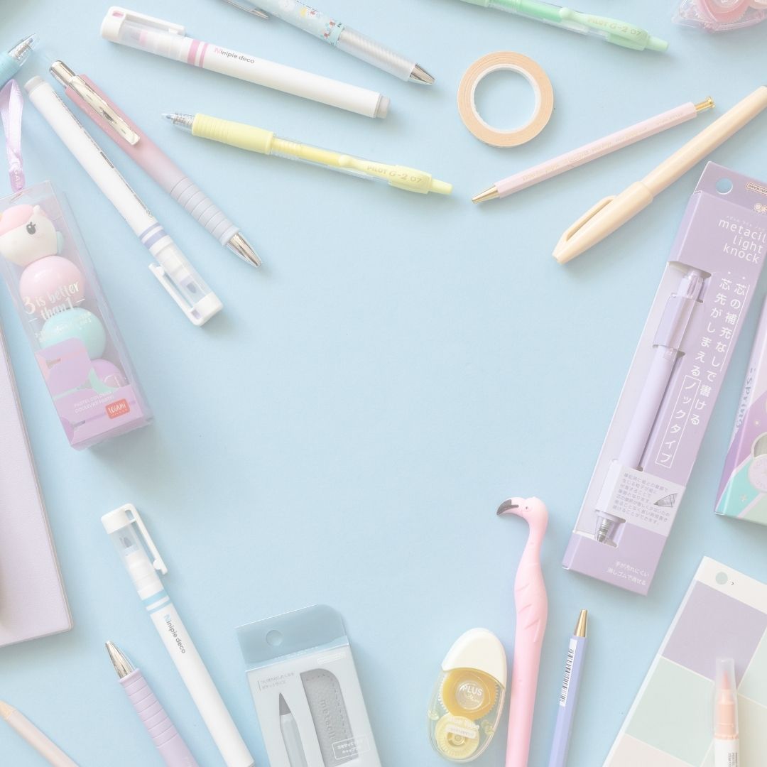 Assorted cute stationery items including pens, markers, and tape on a light blue background