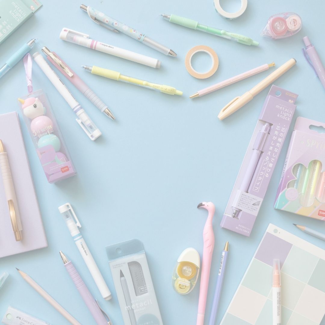 Assorted stationery items including pens, markers, and tape on a light blue background