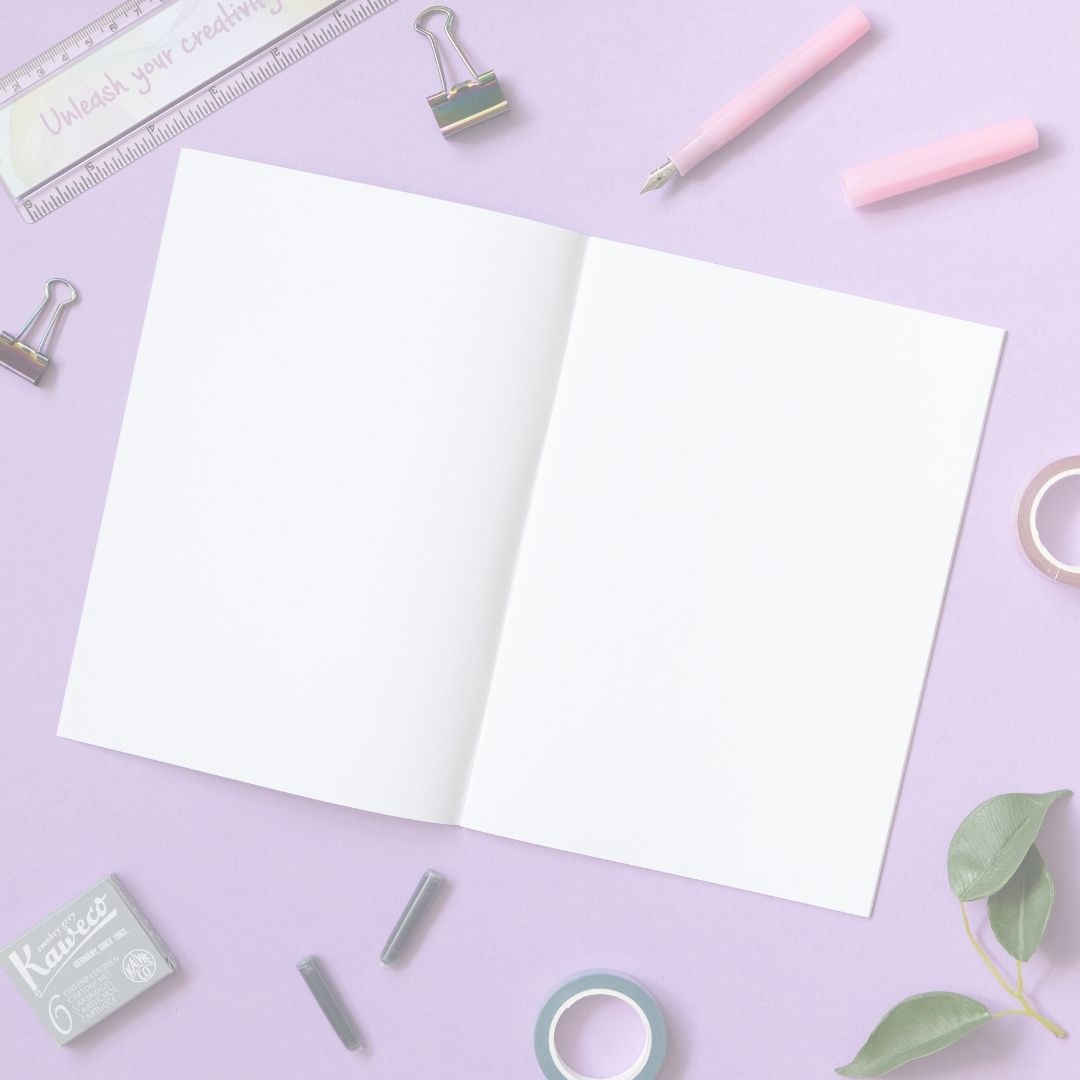 Open notebook with stationery items on a purple background
