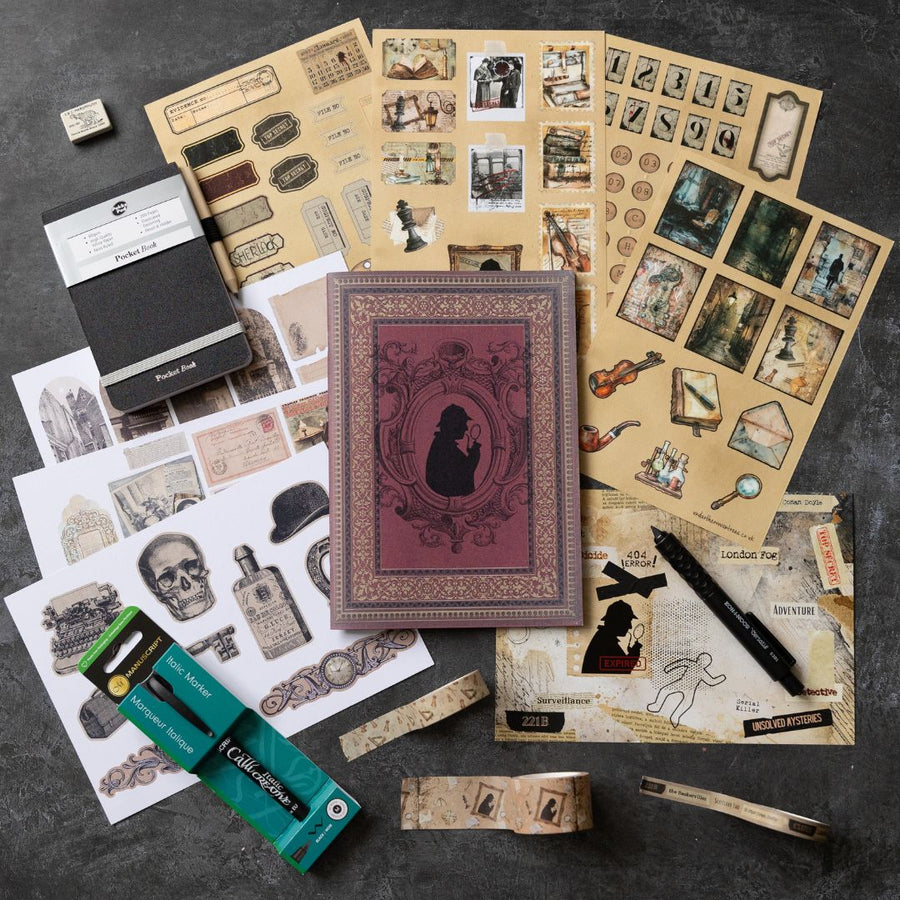 Collection of vintage-style stationery items on a dark surface